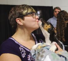 Saturday, April 27 at the Highland Lakes YMCA in Burnet at the Wags to Riches fundraiser Julia Nedbaleck received a kiss from the live auction puppy which raised $700 for Hill Country Humane Society. Photos by Martelle Luedecke/Luedecke Photography