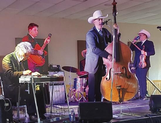 Jake Hooker and the Outsiders kept the crowd on their feet at the recent Joseph's Hammer fundraiser for the women's prison chapel in Burnet. Contributed photos/Pam Stevenson