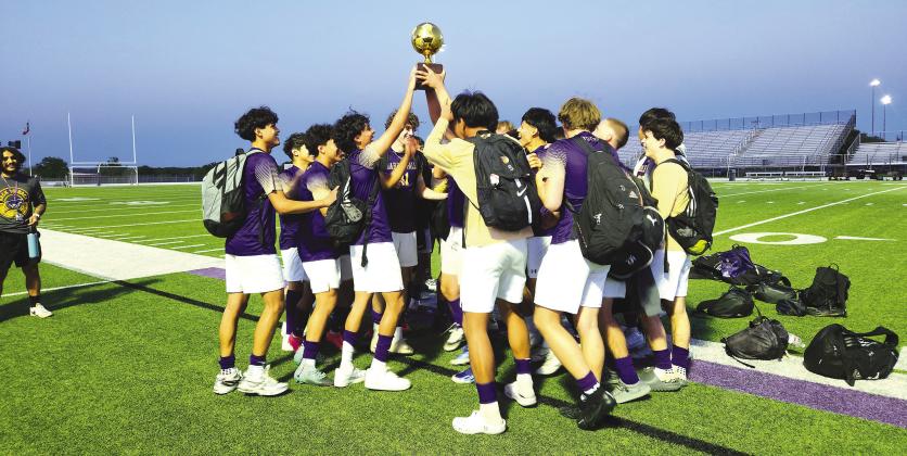 The Marble Falls Mustangs hoist the first of three trophies they won during the 2024 season. The Mustangs added another award, this one for how they conduct themselves during matches. Photos by Jennifer Fierro/TexasChalkTalk.com